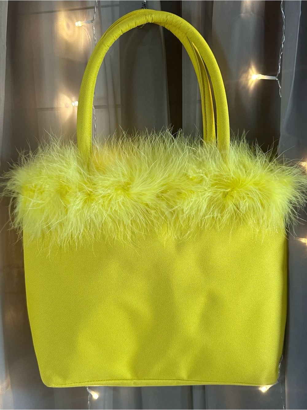 Large yellow feather trim bucket bag